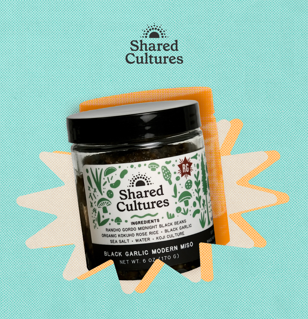 The Shared Cultures logo and an image of a container of their black garlic modern miso.